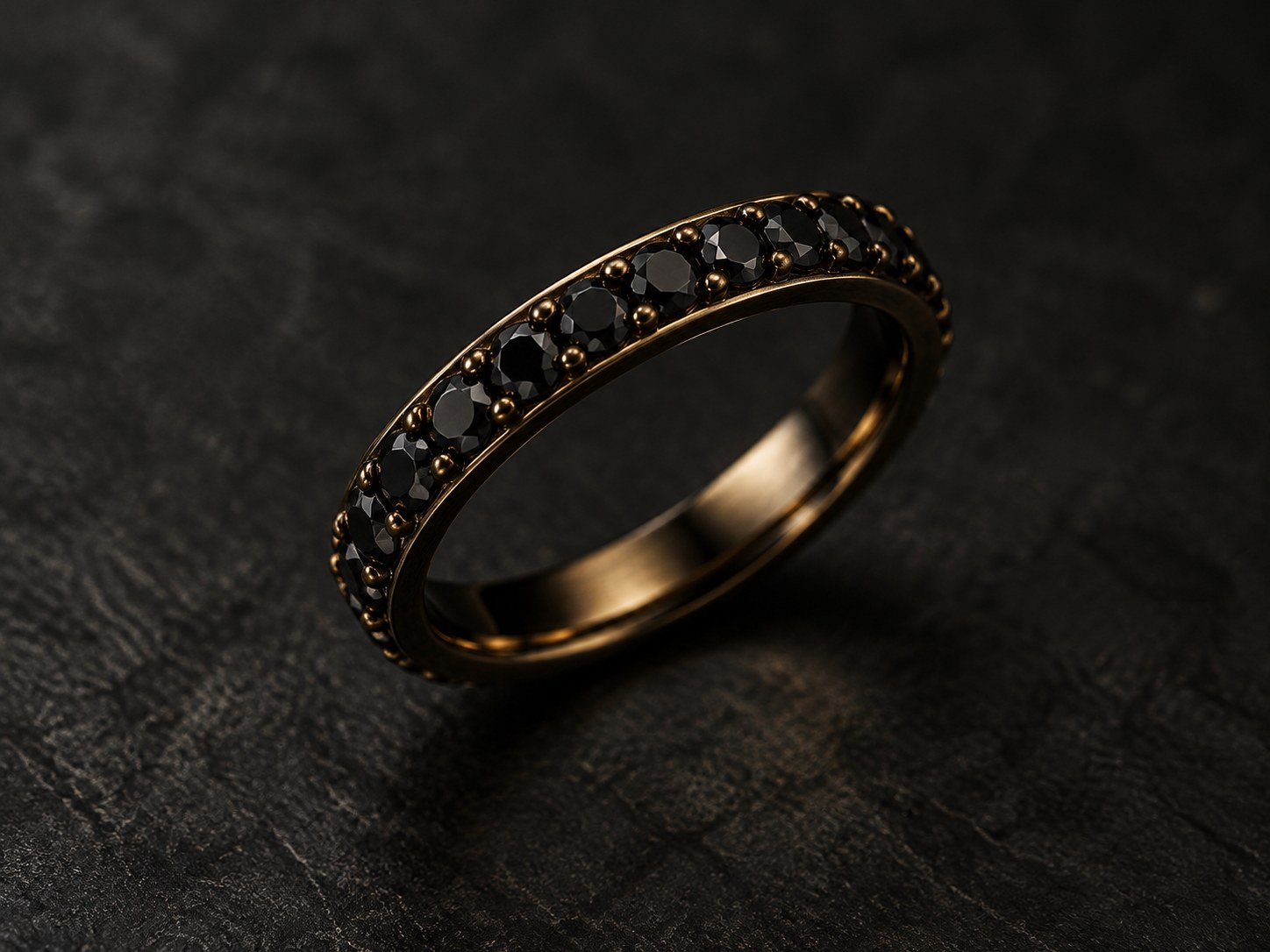 A black wedding band set with small black diamonds in dark gold, macro shot, AI-generated illustration