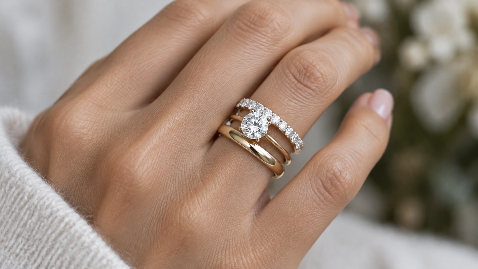 AI-generated illustration of a bridal ring stack with a wedding band, engagement ring and eternity ring