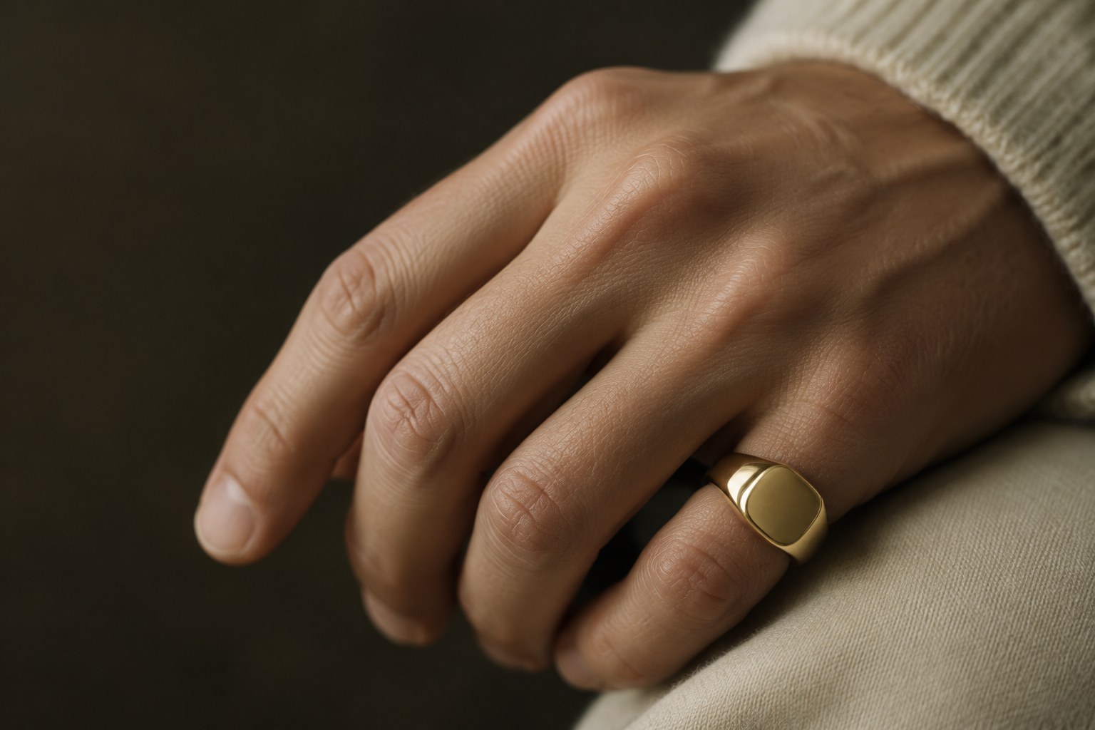 AI illustration of a bold gold signet ring on a little finger