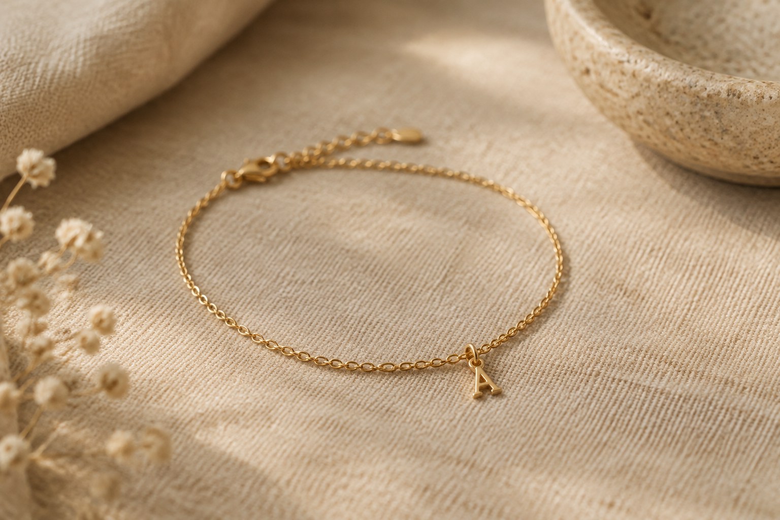 AI illustration of a gold bracelet with an initial charm